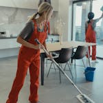 Woman Holding a Mop